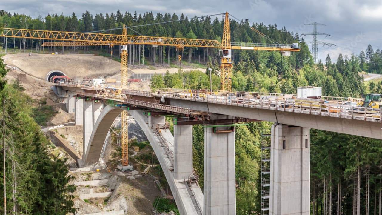 Bridge construction project under construction in a remote forested area